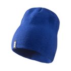 Blue knit beanie hat with a small rectangular tag on the brim, isolated on a white background.