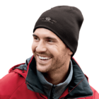 Smiling man in a red jacket and black beanie with Blue Lake Resort logo.
