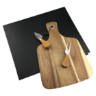 Personalised Delta Compact Cheeseboard set with knives on a sleek black backdrop.