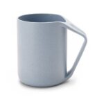 A light blue mug with a sleek, modern design. It has a tall cylindrical shape and a unique angular handle. The surface appears smooth with a matte finish.