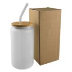 Frosted glass tumbler with bamboo lid, clear straw, and cardboard box beside it.