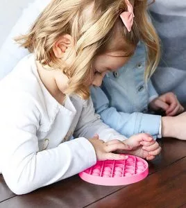 child-using-promotional-fidget-bubbles-268x300