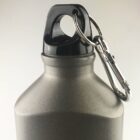 Metal water bottle with a black cap and attached carabiner clip.