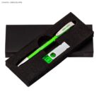 Green pen and white USB drive in a black foam case with a black box underneath.