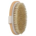 Oval wooden dry brush with natural bristles and a white fabric hand strap.