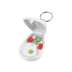 Logo Decorated Keyring Pill Cutters with green tablets and red-white capsules inside.