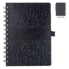 A black spiral-bound notebook with a textured geometric pattern on the cover. A black elastic band wraps around the middle. The insert shows the back side, which is plain.