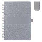 A gray spiral notebook with a textured cover featuring a geometric pattern. A horizontal band divides the design. A small tab is on the side. An inset image shows the plain back cover of the notebook.