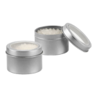 Two small metal tins with clear lids, one open, showing promotional tinned bath salts.