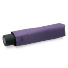 A compact, closed purple umbrella with a matching cover, featuring a black handle. The brand name shelta is visible on the cover. The umbrella is placed on a white background.