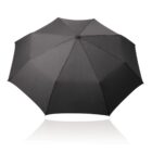 A fully opened black umbrella shown from above, displaying its wide canopy against a white background. The umbrella has a simple, classic design with no visible logos or patterns.