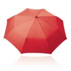 A top-down view of an open, bright red umbrella with eight panels and a black central hub, set against a white background. The umbrellas shadow is faintly visible below.