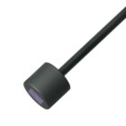 A black cylindrical object with a long handle, featuring a small purple square on one end. The object is isolated on a white background.