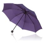 A purple umbrella with a curved canopy and a black handle is open against a plain white background. The umbrella casts a faint reflection on the surface beneath it.