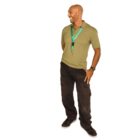 A man with a shaved head is standing and smiling to the side. He is wearing a green polo shirt, black cargo pants, and black shoes. A green lanyard with keys hangs around his neck. The background is white.