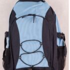 A blue and black backpack with adjustable shoulder straps, a handle on top, front zipper pocket, mesh side pockets, and elastic cord detailing on the front. It is placed against a plain light-colored background.