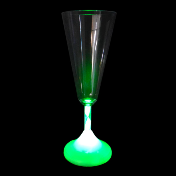 A Champagne Glass with Rainbow Light Colours amidst a black backdrop.