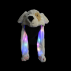 Plush dog-eared hat glows vividly against a black background.