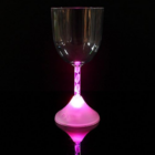 A Flashing Wine Glass with a glowing pink stem/base against a dark background.