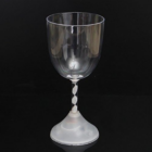Flashing Wine Glass with twisted stem against a black background.