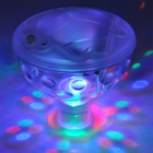 Floating Pool LED Light casting colorful patterns in a dark room.