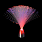 The Lamp with Screw Fibre Optics shines red & purple against a dark backdrop.