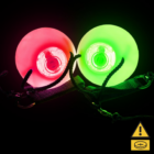 Two LED Poi Balls, one red and one green, glowing in the dark against a black background.