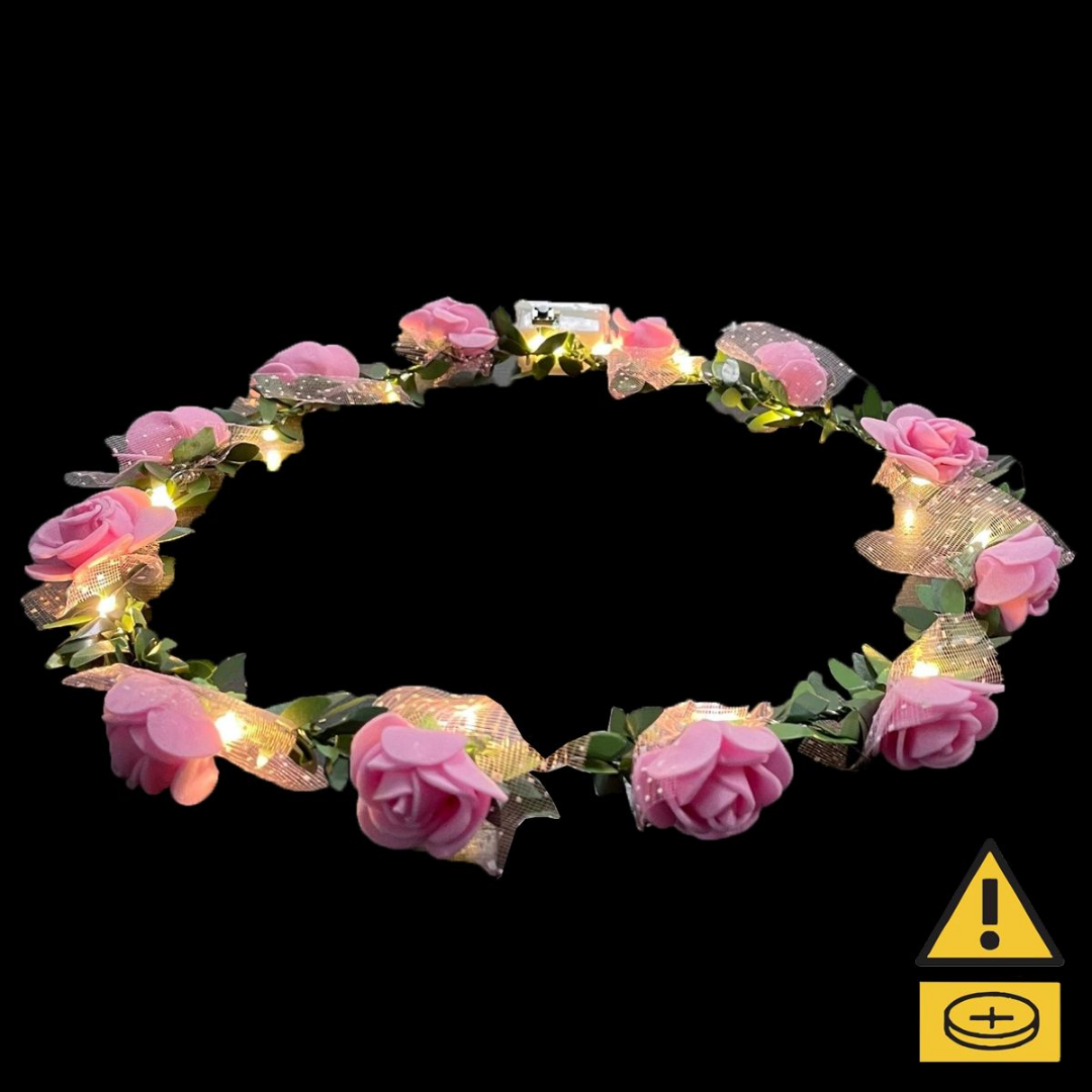 Pink Flower Crown with LED lights on a black background.