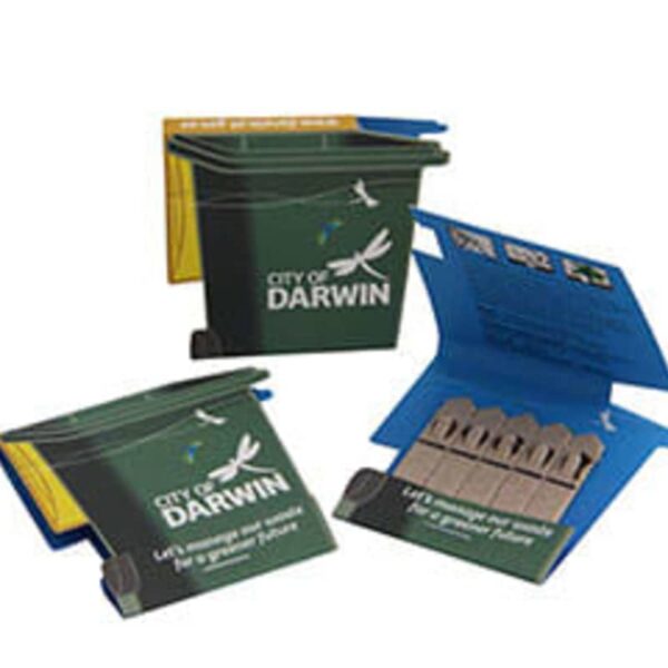 Three small recycling bin-shaped containers branded with City of Darwin. Two are open, revealing cardboard-like contents. Theyve phrases encouraging recycling and sustainability, featuring a bird and leaf design.