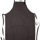 A black apron with vertical white stripes laid flat. It has a neck strap and waist ties. There is a pocket on the front.