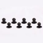 Eight black ball bearings arranged in two rows on a white background.