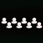 Eight white suction cups on a black background.
