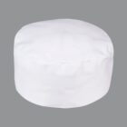 A plain white chefs hat on a gray background.