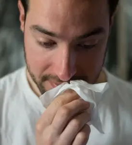 man_using_facial_tissue