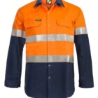 A high-visibility industrial work shirt with a bright orange top half, reflective silver stripes across the chest and arms, and a dark blue lower half and sleeves. The shirt has buttoned pockets on the chest and a collar.
