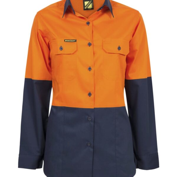 A long-sleeved shirt with an orange top half and dark navy bottom half. It features two front pockets and a button-down design, with a logo patch above the left pocket.