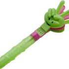 A green and pink plastic toy clapper in the shape of a hand. The toy features a smiling face on the green hand and is attached to a clear green handle.