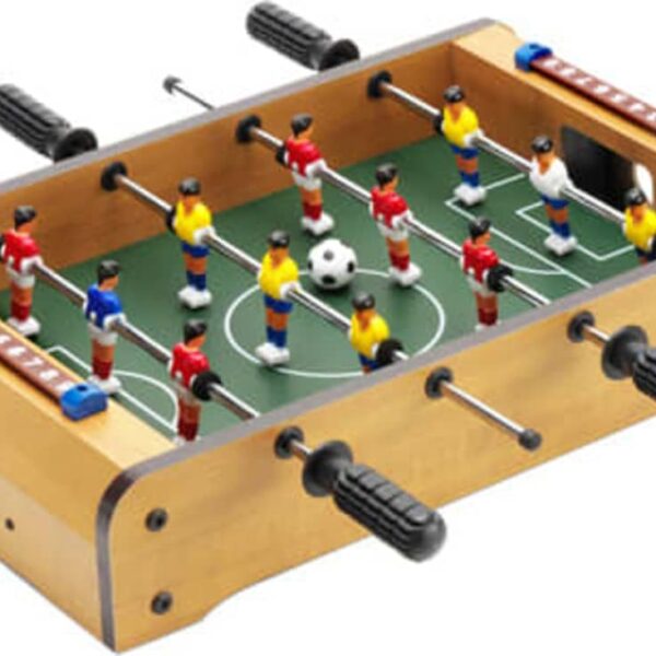 Tabletop foosball game with red and yellow teams on a wooden board.