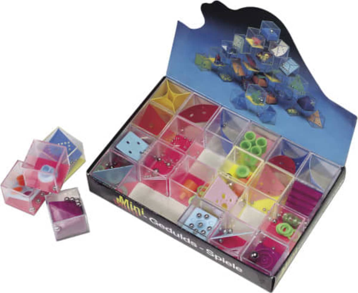 Open box of colorful mini puzzle games with small metal balls, some puzzles placed outside the box.