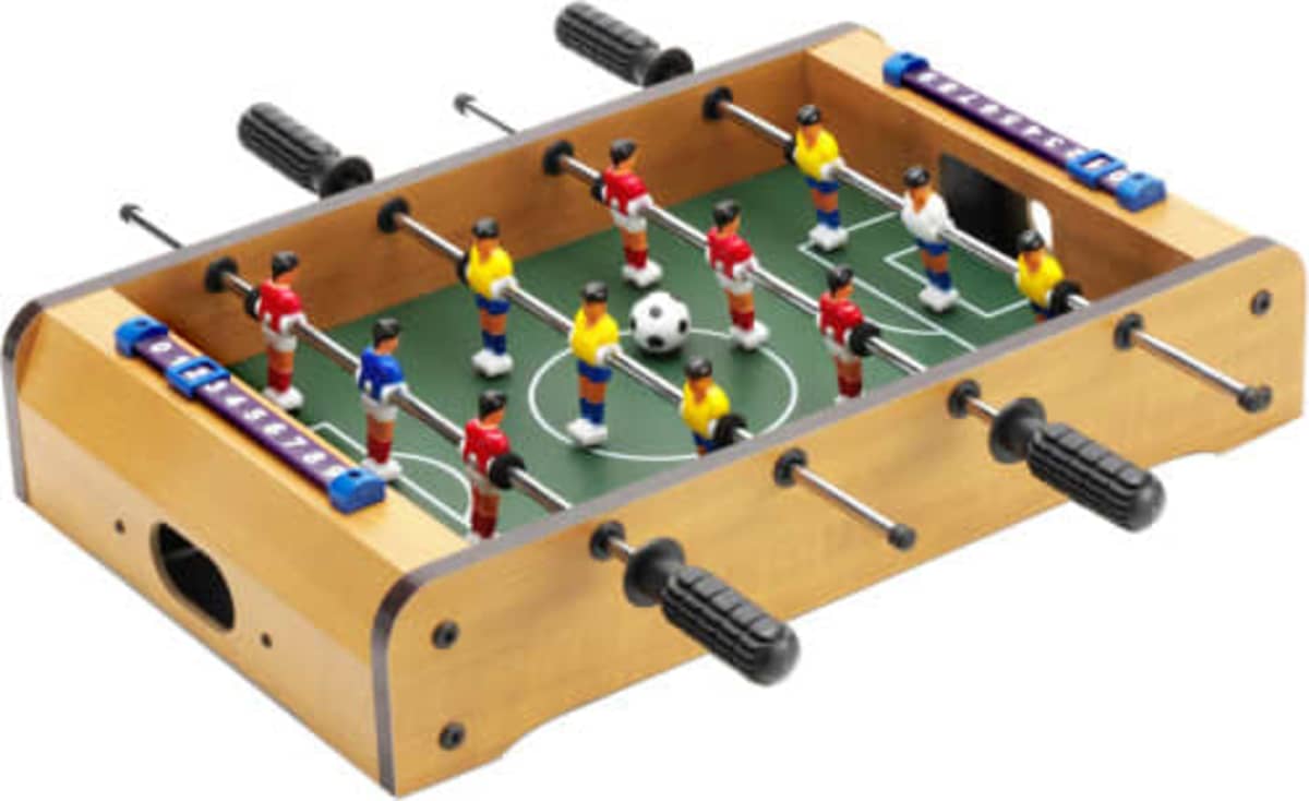 Tabletop foosball game with red and yellow teams and a small soccer ball in play.