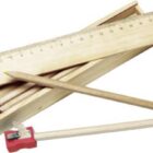 Wooden pencil case with pencils, a ruler, and a sharpener with a long pencil.