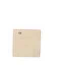 A small beige fabric patch with CE markings.