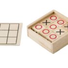Wooden tic-tac-toe game with pieces in a box and an empty grid beside it.