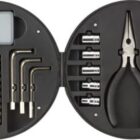 Round black tool kit with pliers, screwdrivers, hex keys, sockets, and a small digital display.