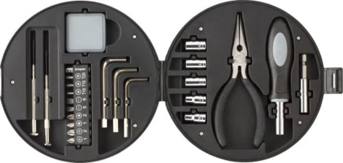 Round black tool kit with pliers, screwdrivers, hex keys, sockets, and a small digital display.