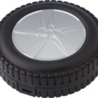 Round black and silver object shaped like a tire, possibly a container or electronic device.