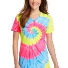 Person wearing a colorful tie-dye T-shirt with spiral patterns, smiling, hands by sides.