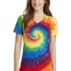 Person wearing a colorful tie-dye spiral shirt and jeans, smiling.