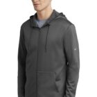 Man wearing a dark gray zip-up hoodie with a Nike logo on the left sleeve.