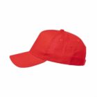 A plain red baseball cap viewed from the side on a white background.